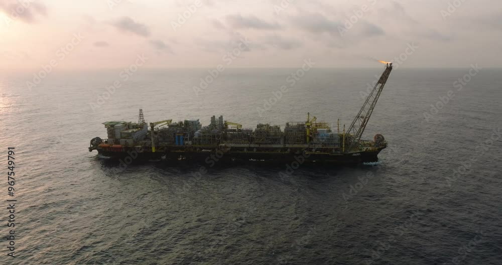 Macao, Brazil - 01 August 2024: Aerial view of the industrial offshore support vessel FPSO FORTE surrounded by ocean waves, Macae, Brazil. Macao, Brazil - 01 August 2024: Aerial view of the industrial offshore support vessel FPSO FORTE surrounded by ocean waves, Macae, Brazil.
