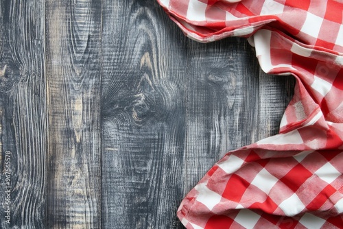 Picnic tablecloth with red checkered pattern on white wood, top view. Text space available.