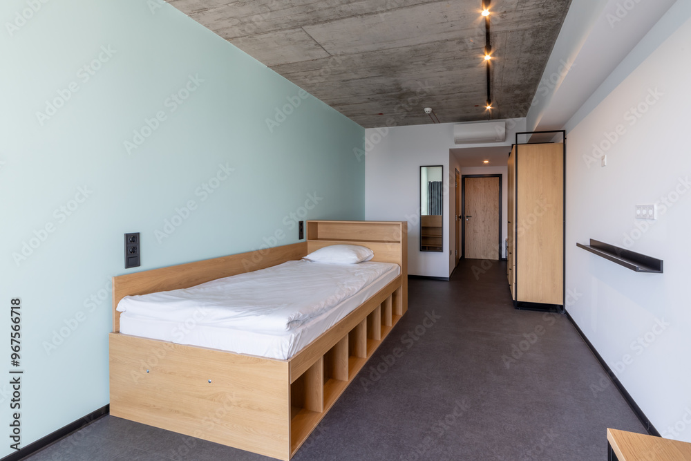 Φωτογραφία Simple student-style dorm bedroom. Hostel dormitory room. Campus