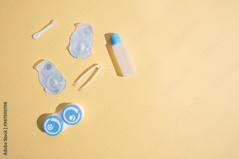 Container for lenses and accessories on a light background. Health and medicine concept Container for lenses and accessories on a light background. Health and medicine concept