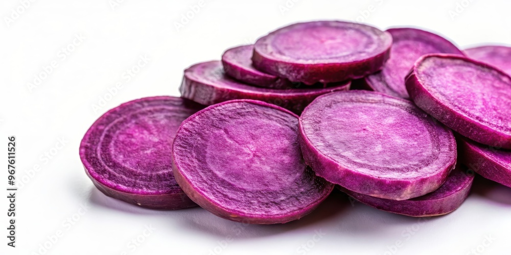 Purple sweet potato slices on a white background, purple sweet potato, sliced, vibrant, colorful, healthy, root vegetable Purple sweet potato slices on a white background, purple sweet potato, sliced, vibrant, colorful, healthy, root vegetable
