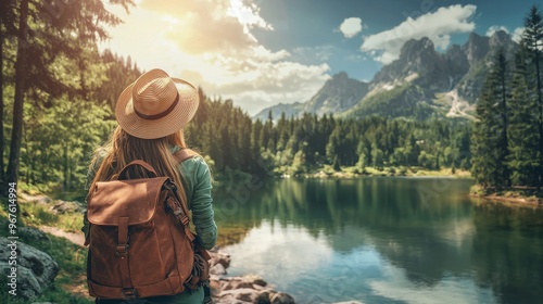 Stunning mountains and forest view, wanderlust travel concept, space for text, atmospheric epic moment, woman traveling with backpack holding hat.