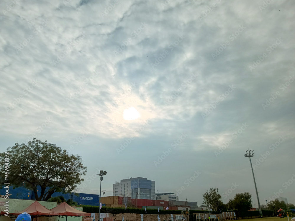 Cloudy Sky Over Urban Landscape with Buildings and Trees Cloudy Sky Over Urban Landscape with Buildings and Trees