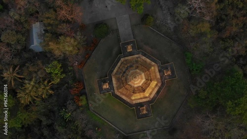 Aerial view of the serene Wat Pa Phon Phao temple amidst lush tropical forest at sunset, Luang Prabang, Laos. photo