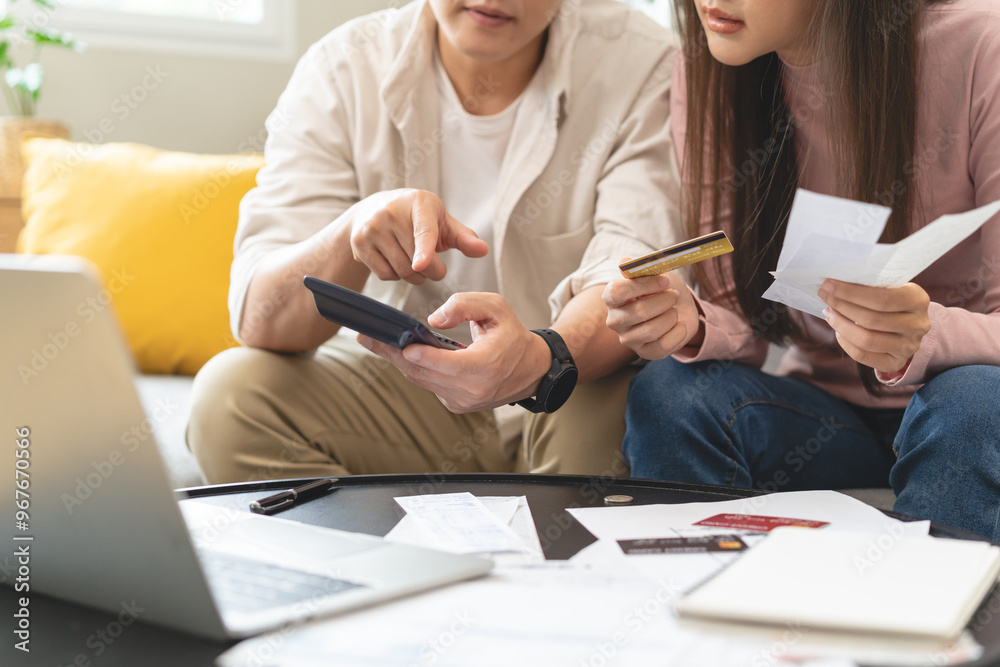 Φωτογραφία Stressed financial owe asian young couple love sitting suffer, stressed and confused by calculate expense from invoice or bill, no money to pay, mortgage or loan