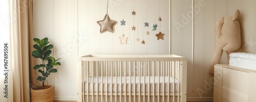 A cozy nursery featuring a wooden crib, decorative stars, and a soothing color palette for a calming baby environment.