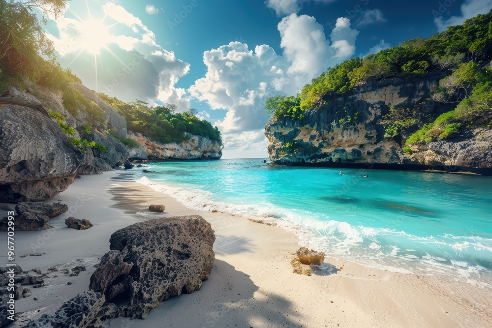 Fototapeta premium Beautiful tropical beach with turquoise water, white sand, and lush green cliffs under a bright blue sky. A perfect getaway destination.