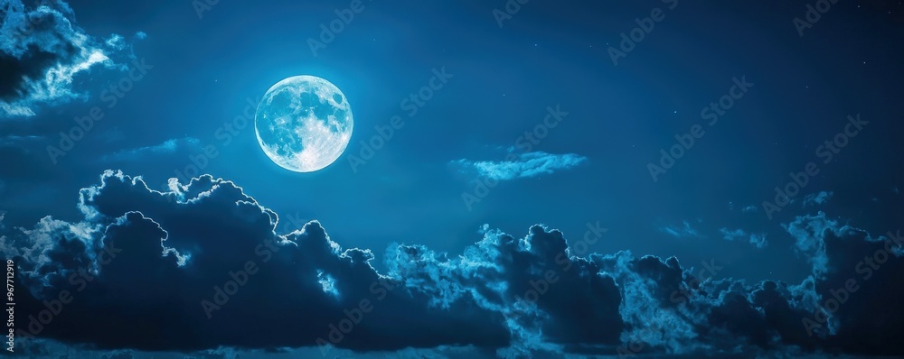 Enchanting Moonlit Night A Captivating View of the Full Moon Illuminating the Sky with Clouds. Enchanting Moonlit Night A Captivating View of the Full Moon Illuminating the Sky with Clouds.