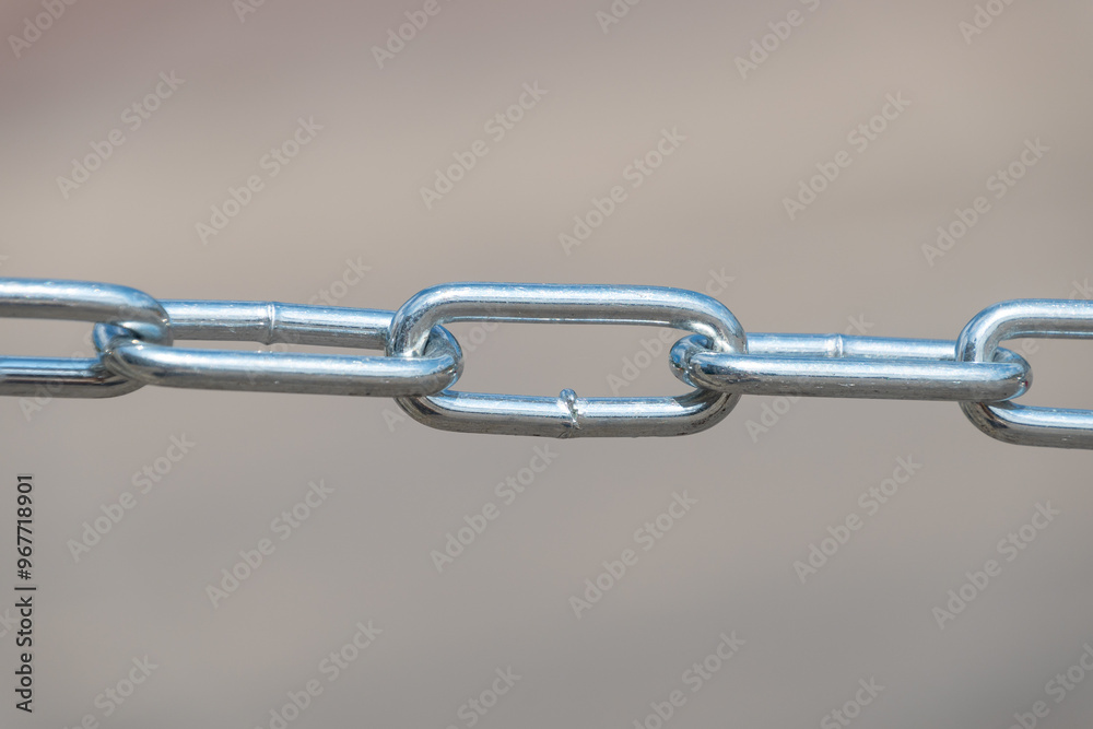 Close-up of short-link welded galvanized chain. Close-up of short-link welded galvanized chain.
