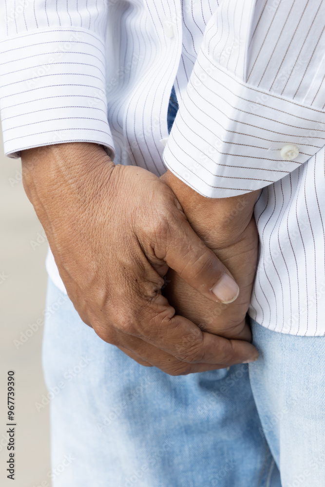 Middle aged old African man having UTI urinary tract infection or bladder infection, premature