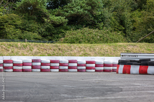 Pit lane entrance on a kart racetrack, Image shows a outdoor go kart track with the pit lane entrance allowing karts to come off the track into the pits