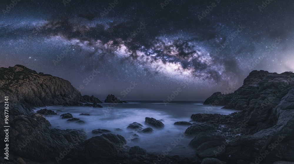A stunning night sky panorama showcasing the Milky Way over rocky coastal scenery. A stunning night sky panorama showcasing the Milky Way over rocky coastal scenery.