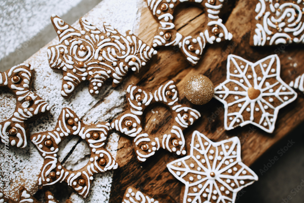 Fototapeta premium hand-decorated christmas cookies on a wooden background