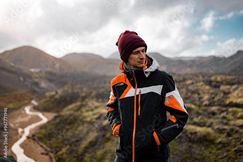 Adventurous Hiker in black Jacket Exploring Mountain Landscape