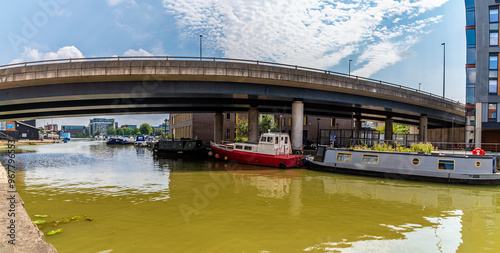 A view up Foss Dyke under the Brayford Way bridge towards Brayford Pool in Lincoln, Lincolnshire in summertime photo