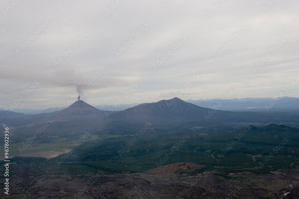 Russia Kamchatka volcano eruption on a cloudy summer day Russia Kamchatka volcano eruption on a cloudy summer day