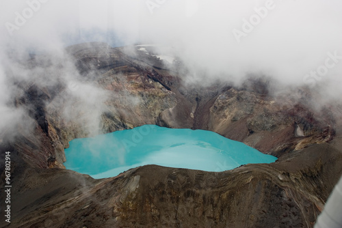 Russia Kamchatka acid lake in Maly Semyachik volcano on a summer cloudy day photo