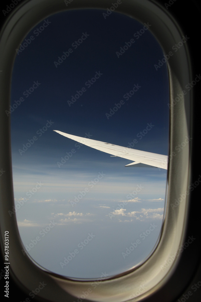 airplane window with view to the wing airplane window with view to the wing