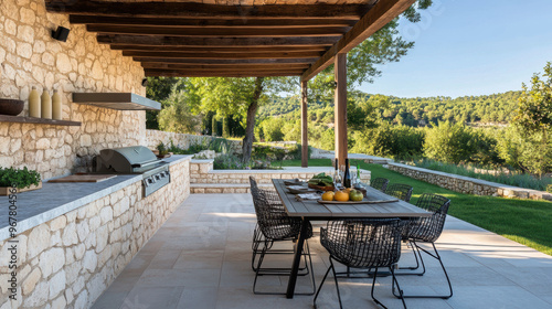 terrasse avec pergola, barbecue, table et chaises pour diner en extérieur photo