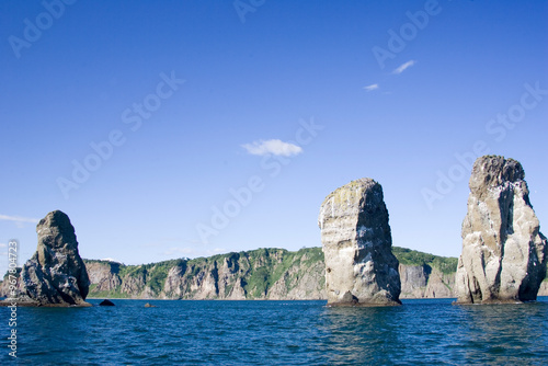 Russia Kamchatka rocks 3 brothers on a cloudy summer day photo