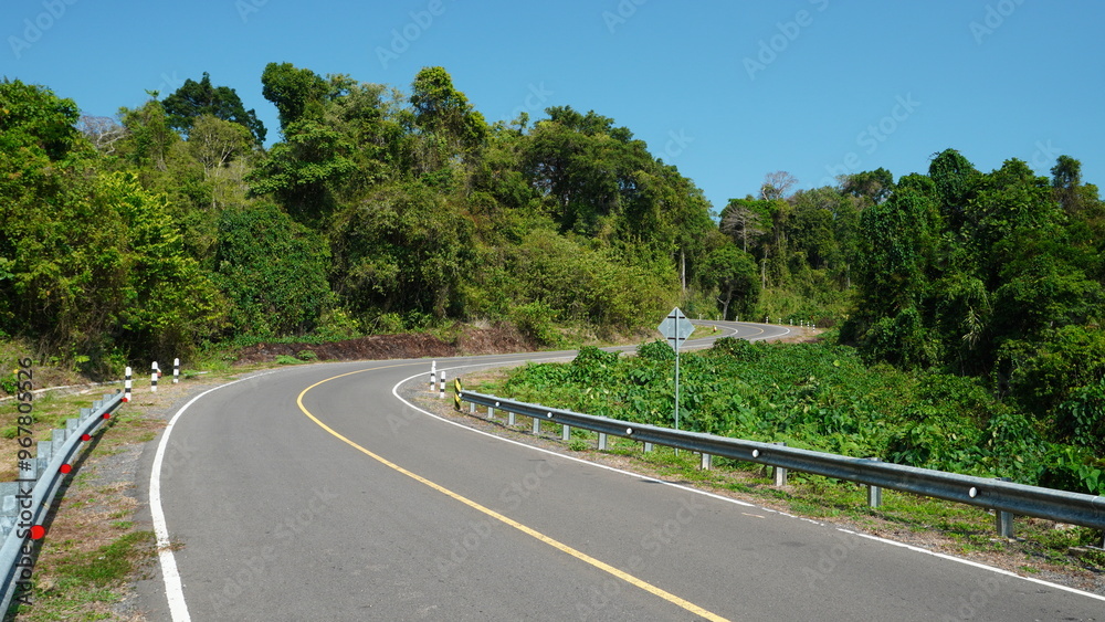road with its facilities in tropical forest road with its facilities in tropical forest