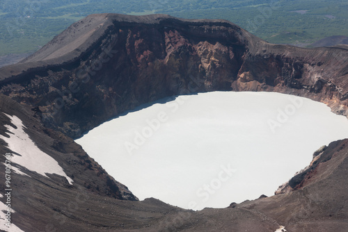 Russia Kamchatka acid lake in Maly Semyachik volcano on a summer cloudy day photo