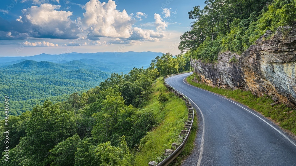 Obraz premium Winding mountain road leading to a scenic overlook