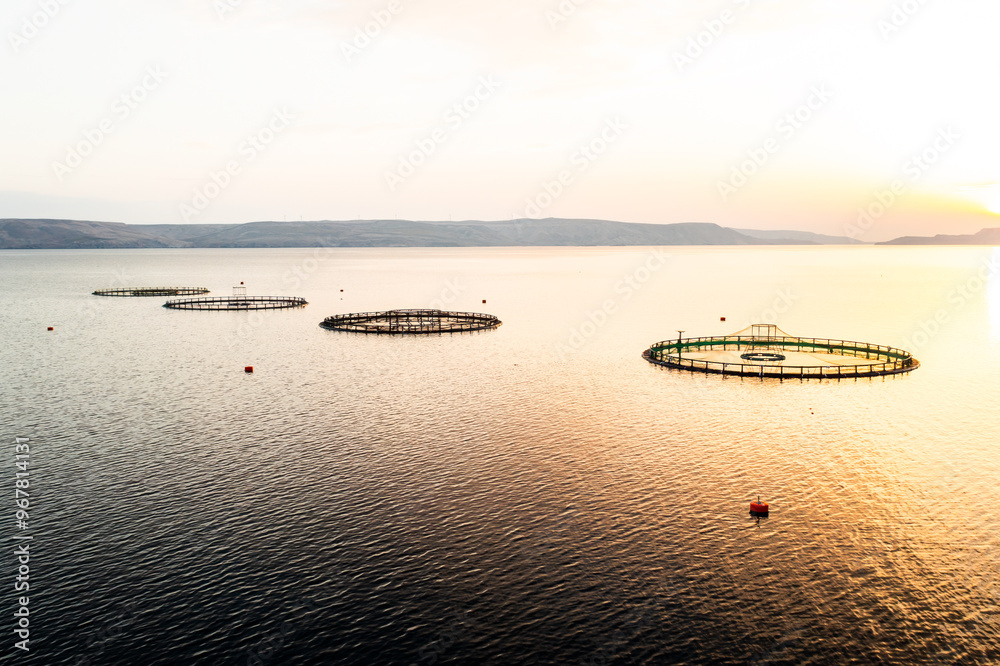 Croatian fish farm infrastructure in Adriatic Sea aerial view. Demonstration of innovative techniques used to ensure sustainable fish breeding Croatian fish farm infrastructure in Adriatic Sea aerial view. Demonstration of innovative techniques used to ensure sustainable fish breeding