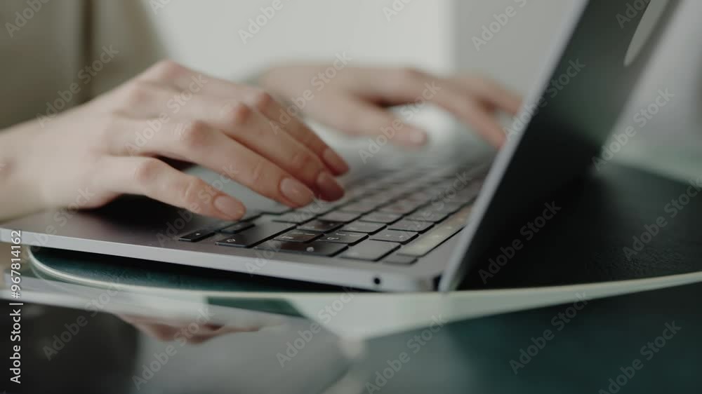 Close-up shot of hands typing on a laptop, ideal for illustrating remote work, office tasks, or online communication. Close-Up of Hands Typing on a Laptop in a Modern Office Setting Close-up shot of hands typing on a laptop, ideal for illustrating remote work, office tasks, or online communication. Close-Up of Hands Typing on a Laptop in a Modern Office Setting