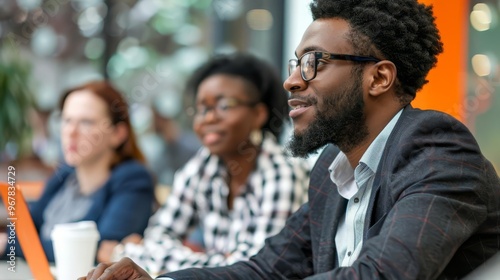 Focused businessman listening attentively in a meeting.