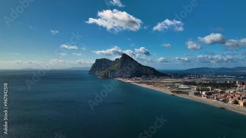 Aerial view of the majestic rock of Gibraltar surrounded by the ocean and clouds, Gibraltar.