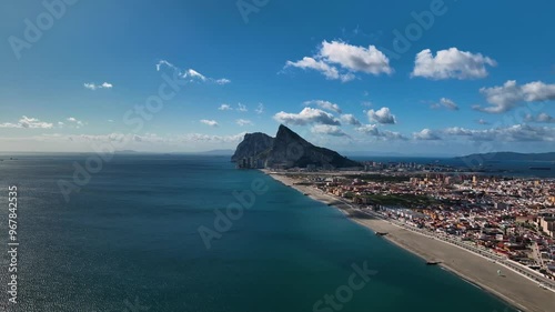 Aerial view of the rock of Gibraltar surrounded by ocean and clouds, Gibraltar.