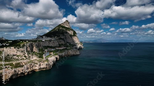 Aerial view of the rock of Gibraltar surrounded by ocean and clouds, Gibraltar.