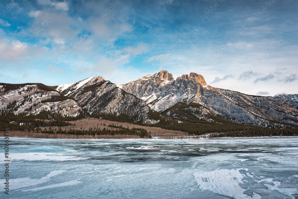 Rocky mountains on frozen lake in Abraham Lake Rocky mountains on frozen lake in Abraham Lake
