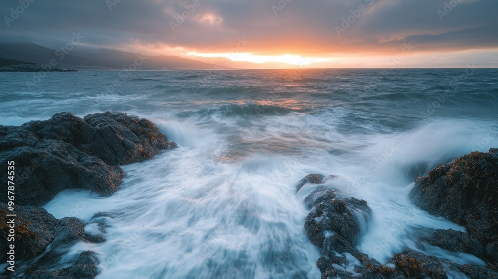 A serene coastal scene at sunset with waves crashing against rocky shorelines. A serene coastal scene at sunset with waves crashing against rocky shorelines.