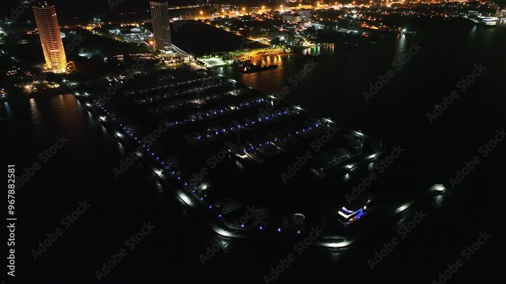 Aerial view drone fly over docked boats at Chalong pier, Yacht club at sunset. Yacht parking. Yachts and boats in marina from above at sunset. Yachts at ocean marina Aerial view drone fly over docked boats at Chalong pier, Yacht club at sunset. Yacht parking. Yachts and boats in marina from above at sunset. Yachts at ocean marina
