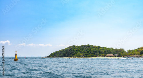 Landscape of island and tropical beach morning day at Koh Larn island on blue sea and blue clear sky background. Pattaya, Thailand. Wave, Speed boat, Ferry ship, Seascape, Vacation, Summer, Holiday.