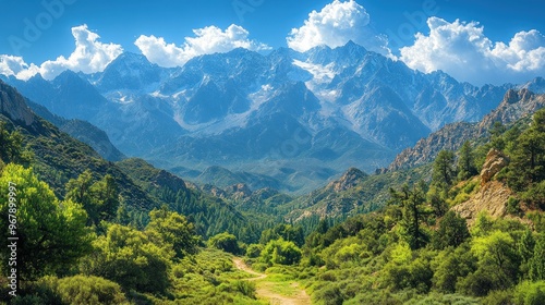 Scenic mountain landscape with lush greenery and blue skies.