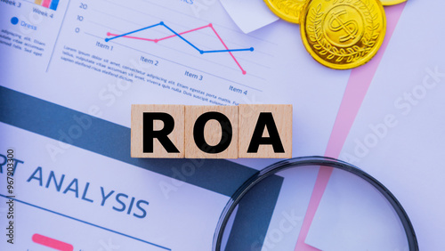 Wooden cube with the word ROA. It is an abbreviation of Return on Assets. Business profitability success growth profitability analytics. Business and financial market concept.
