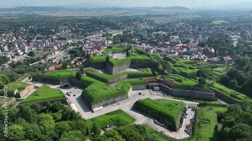 Klodzko Fortress (German: Festung Glatz) – a preserved fortress in Klodzko, a defense system from the 17th and 18th centuries in Poland. Aerial drone view of Klodzko Fortress and town Klodzko photo