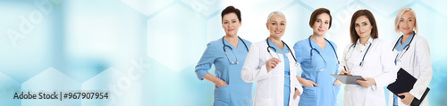 Doctors and medical staff on blurred background. Banner design with space for text