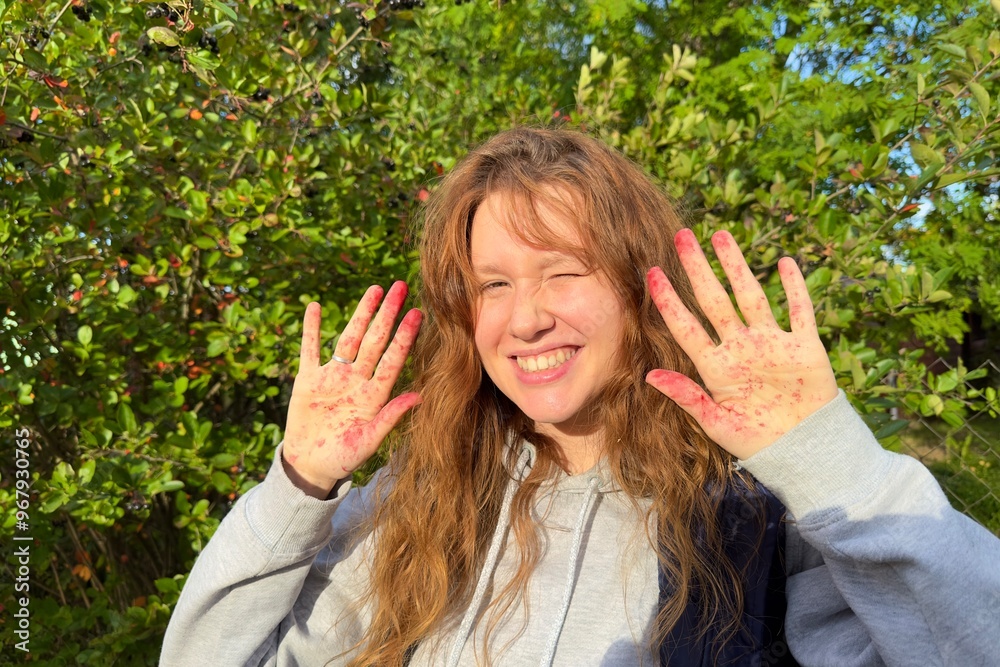 beautiful girl picking berries and making a heart beautiful girl picking berries and making a heart
