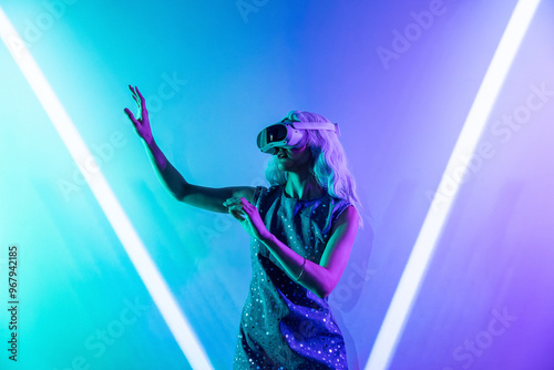 Futuristic woman engrossed in the metaverse experience photo