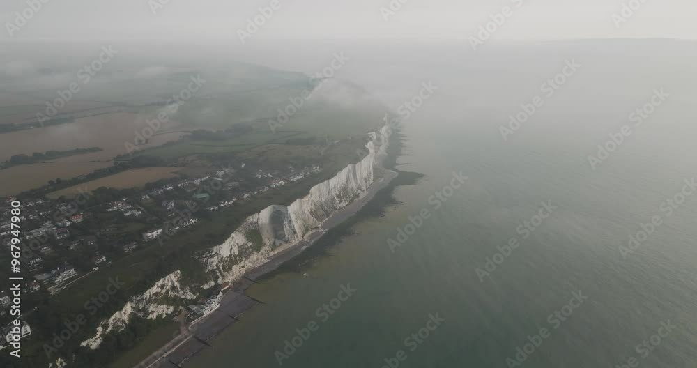 Aerial view of the beautiful white cliffs of Dover along the rugged coastline of the English Channel, Dover, United Kingdom. Aerial view of the beautiful white cliffs of Dover along the rugged coastline of the English Channel, Dover, United Kingdom.
