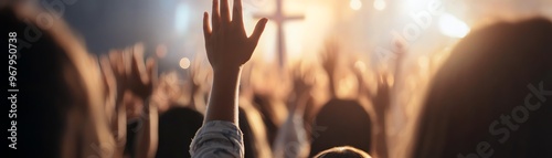 A vibrant crowd with raised hands in a church worship setting, illuminated by warm, glowing lights and a cross in the background.