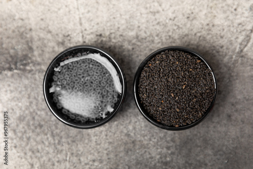 Basil seeds on textured wooden background. Close-up. Superfood. Ocimum basilicum. Organic basil seeds. selasih. Space for text. Copy space. photo