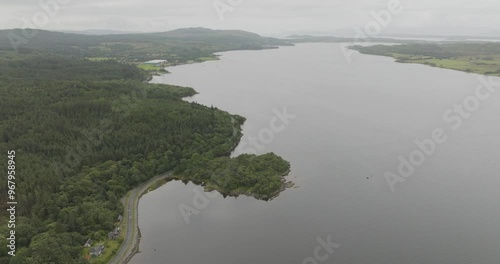 Aerial view of Loch Creran surrounded by lush forest and winding road, Oban, Scotland. photo