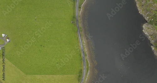 Aerial view of Loch Creran surrounded by green fields and a tranquil coastline, Oban, Scotland. photo