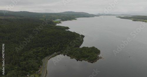 Aerial view of serene Loch Creran surrounded by lush forest and a winding road, Scottish Highlands, United Kingdom. photo