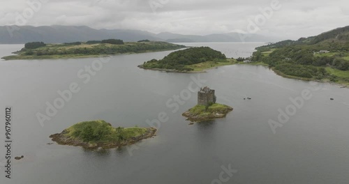 Aerial view of castle stalker on loch linnhe surrounded by tranquil waters and scenic landscape, Appin, United Kingdom. photo